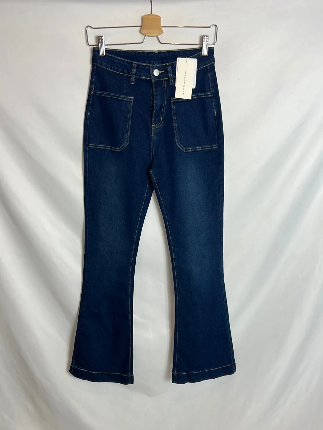 CÓMMENSE. Denim campana bolsillos . T S.