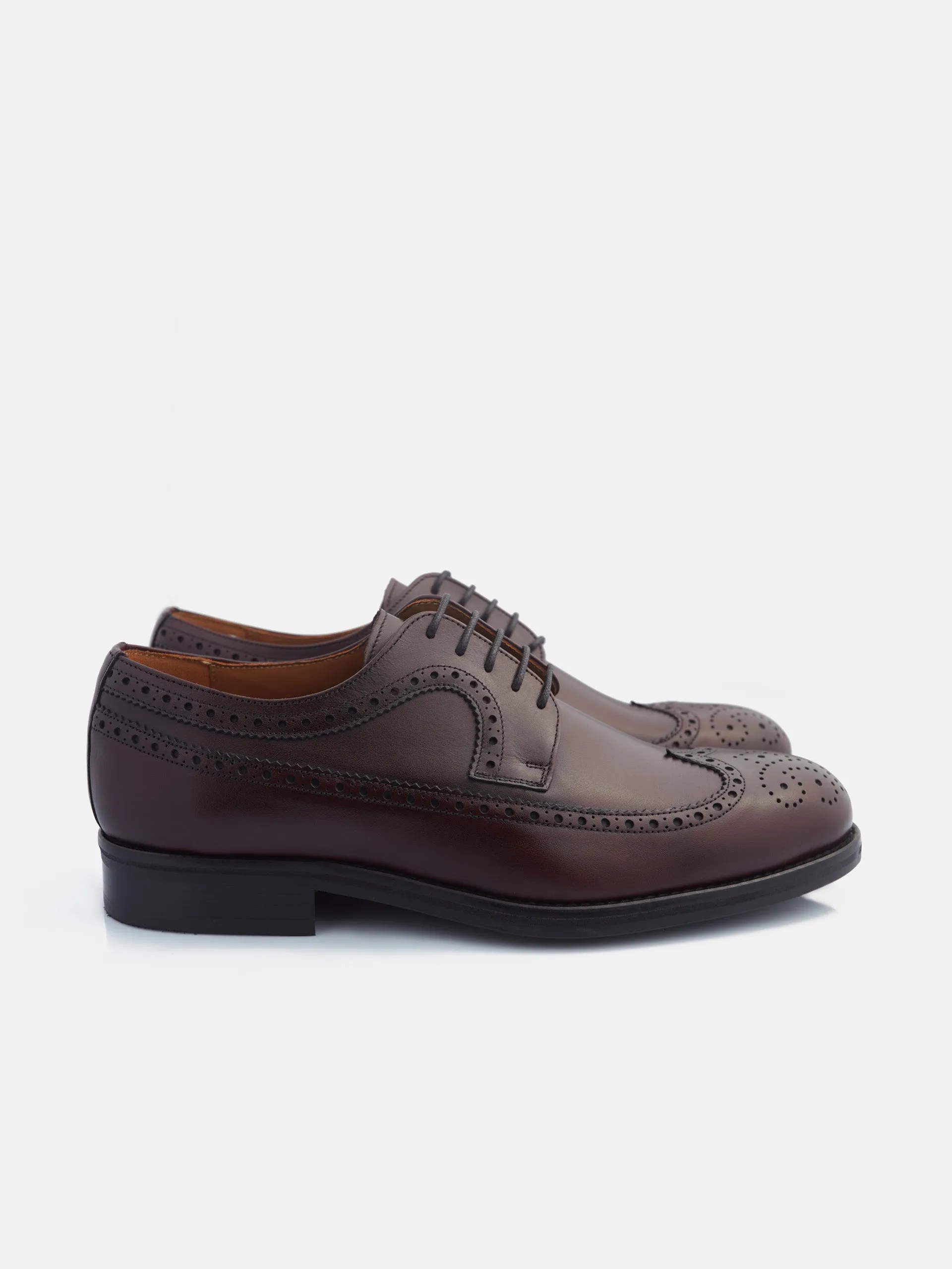 Zapato clasico piel perforado burdeos